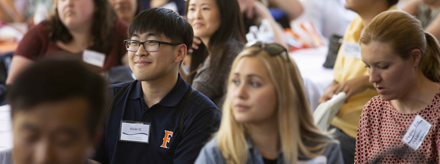 CSUF employee smiling at orientation
