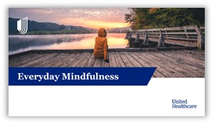 A person sitting on a dock looking at a sunrise.