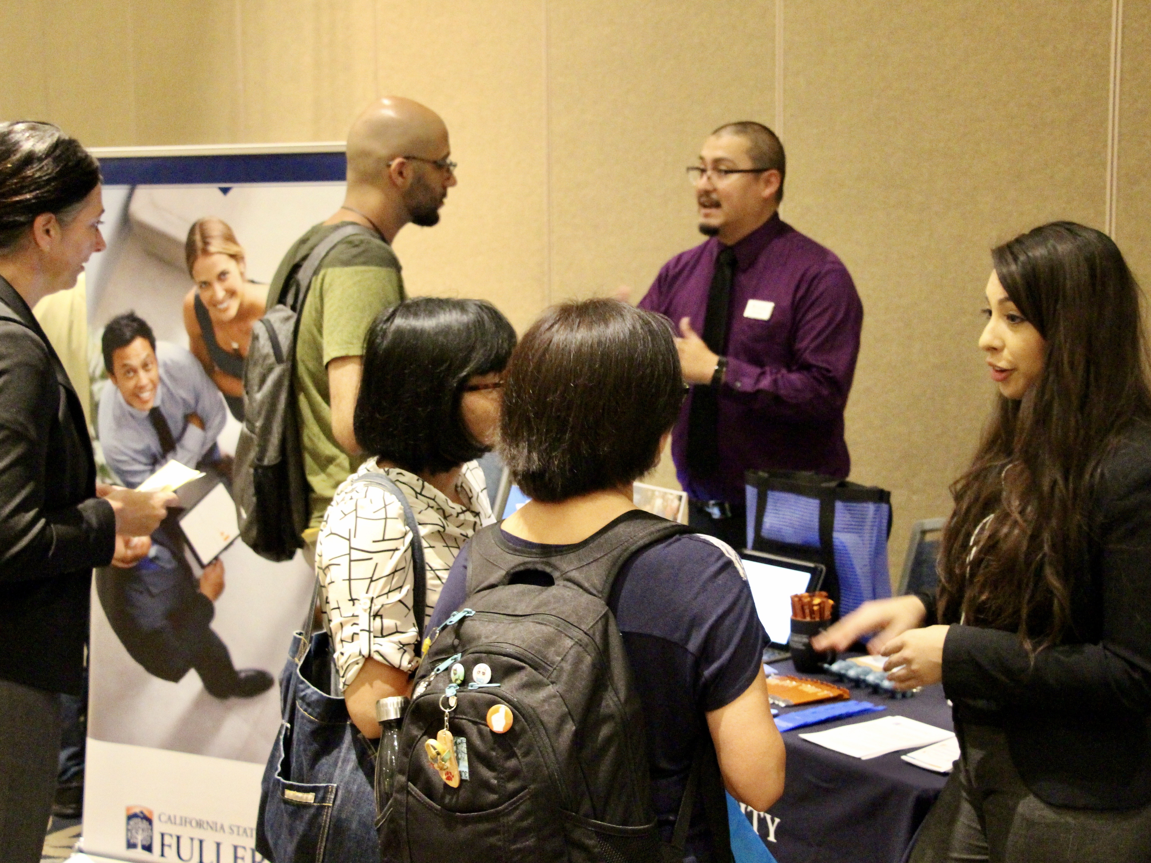 2 group of people networking at the career fair