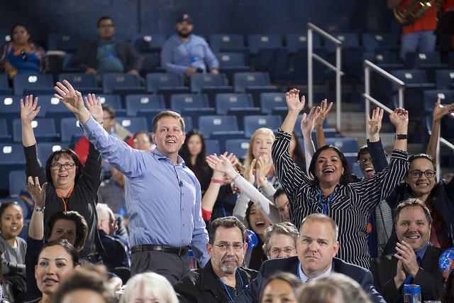 Employees stand up for recognition of years of service at UAP.